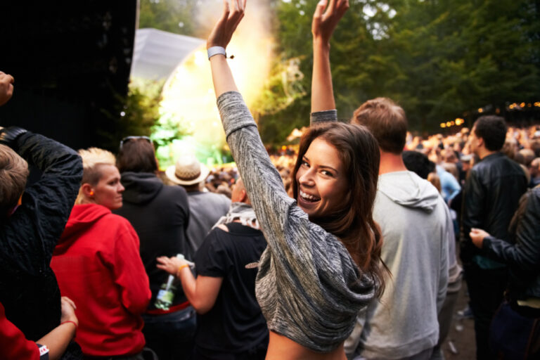 This is amazing. A pretty young woman enjoying the music at an outdoor festival